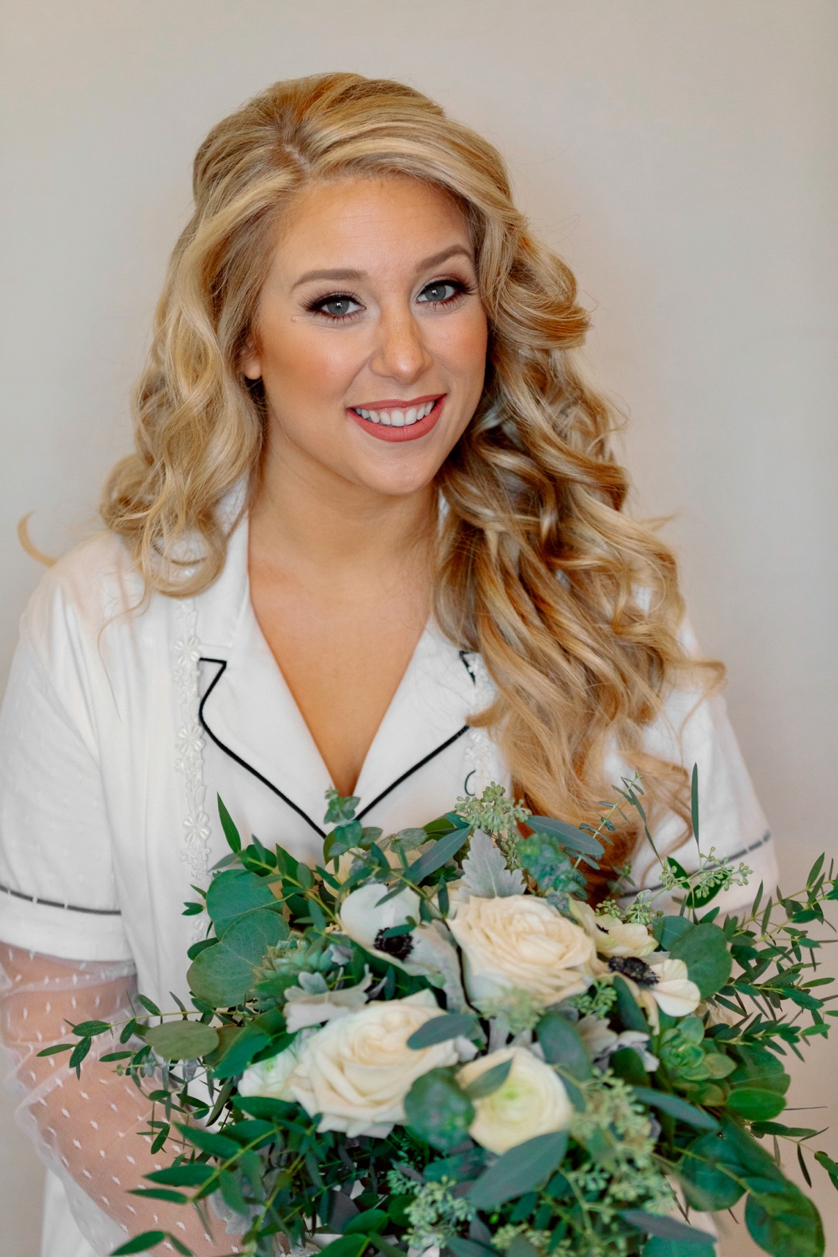 Bride in a robe during morning preparations at the vineyard